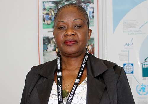 Close up of a woman wearing conference lanyard